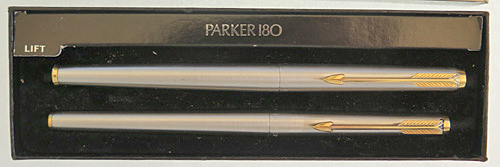 ITEM #4414: PARKER 180 FLIGHTER FOUNTAIN PEN AND CAP ACTUATED BALLPOINT. New Old Stock. XFine / Mediun 14K nib. Gold electroplated trim. Includes Parker converter and cardboard jacket for the box.